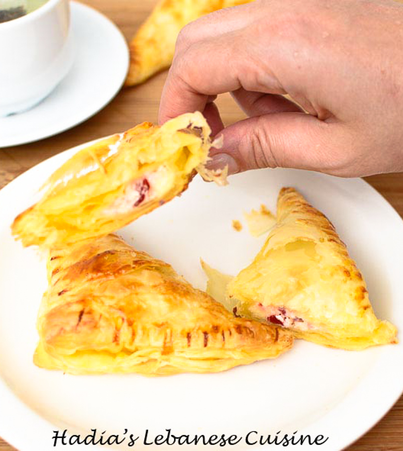 Cheese and Pastirma turnovers.   These freshly baked flaky triangles are filled with goodness of cheese and pastirma.